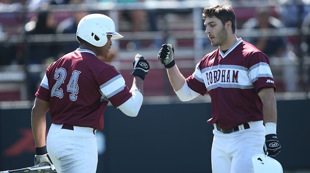Teammates fist bumping